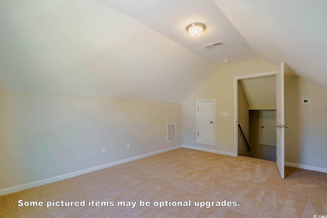 bonus room with carpet, visible vents, vaulted ceiling, and baseboards