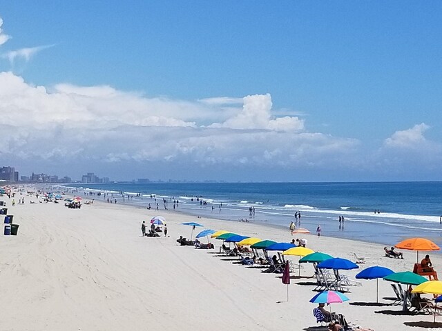 property view of water featuring a beach view