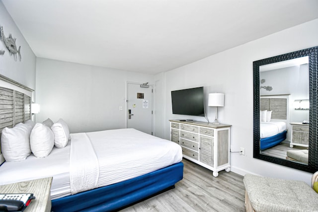 bedroom featuring wood-type flooring