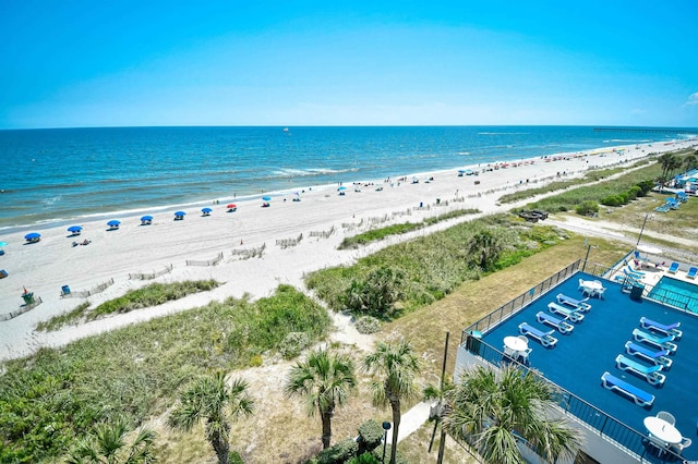 drone / aerial view with a beach view and a water view