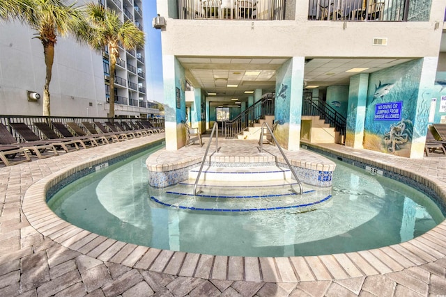 view of pool featuring a patio area