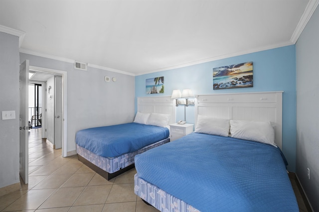 bedroom with light tile patterned floors, baseboards, visible vents, and crown molding