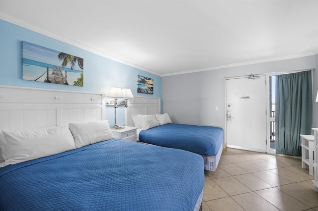 bedroom with light tile patterned floors and ornamental molding