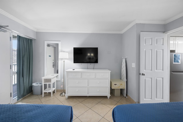 bedroom featuring freestanding refrigerator, crown molding, and light tile patterned floors