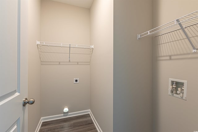 laundry area featuring hookup for a washing machine, electric dryer hookup, and dark wood-type flooring