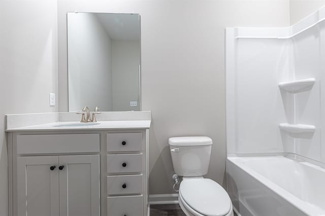 bathroom featuring hardwood / wood-style flooring, vanity, and toilet