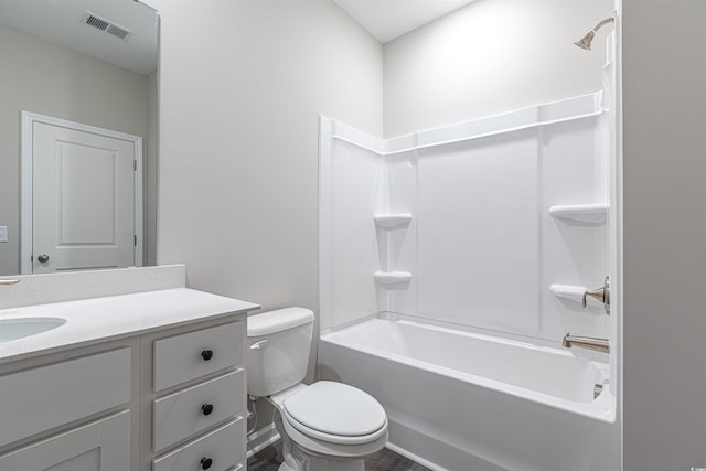 full bathroom with vanity, toilet, and washtub / shower combination