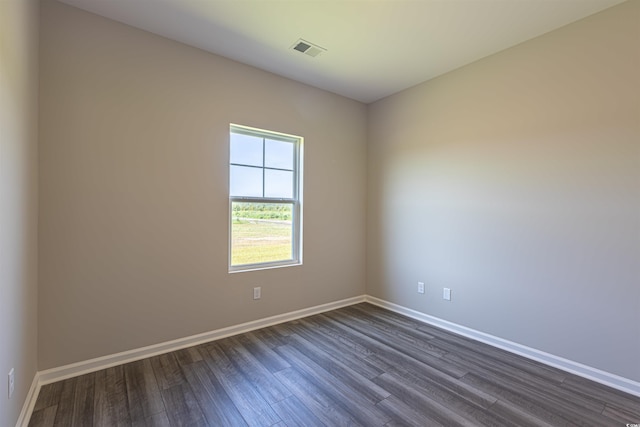 empty room featuring dark wood-type flooring