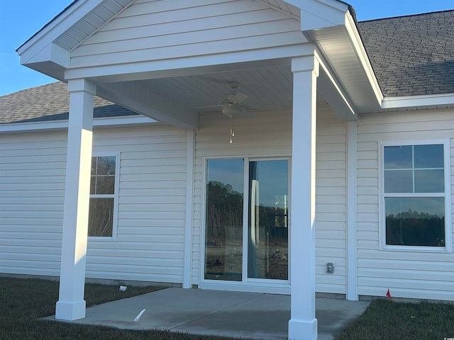 entrance to property featuring ceiling fan and a patio area