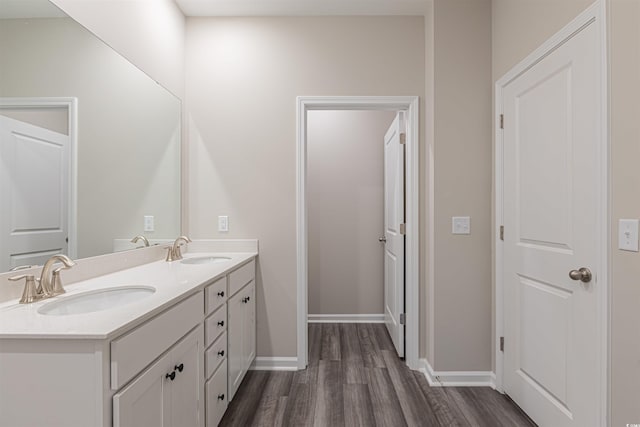 bathroom with vanity and wood-type flooring