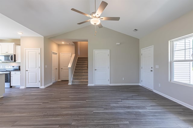 unfurnished living room with ceiling fan, dark hardwood / wood-style flooring, and vaulted ceiling