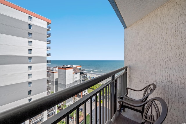 balcony featuring a water view