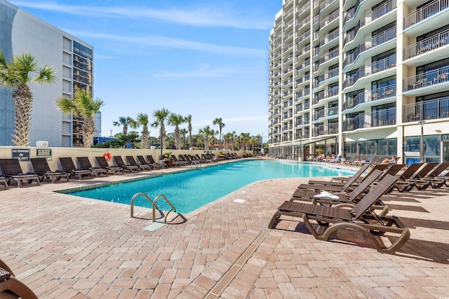 community pool with a patio