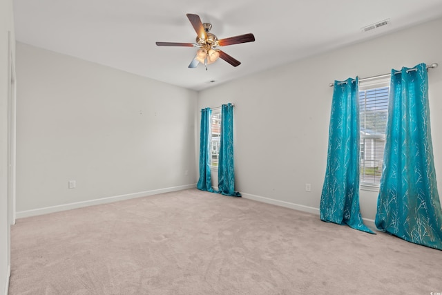 carpeted empty room with ceiling fan