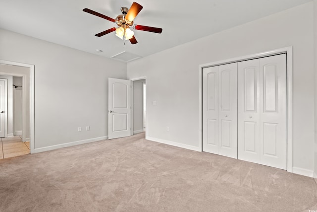 unfurnished bedroom featuring ceiling fan, carpet, and a closet