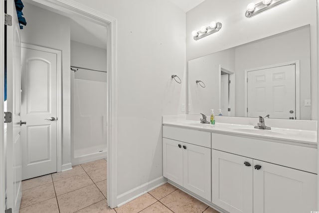 bathroom featuring a shower, tile patterned flooring, and vanity