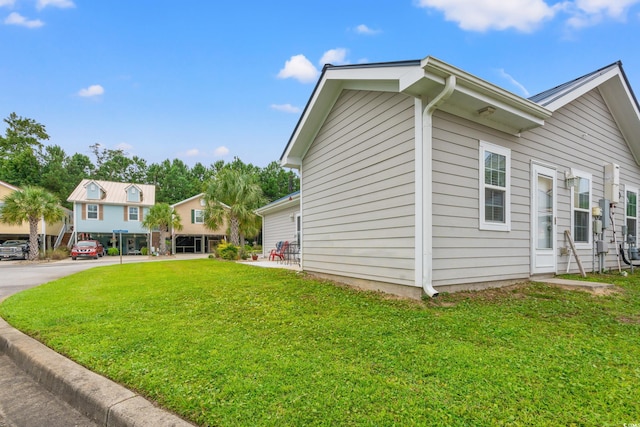 view of property exterior with a lawn