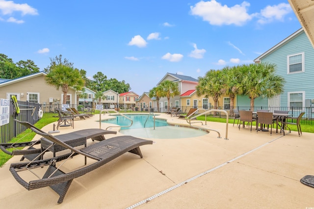 view of pool featuring a patio