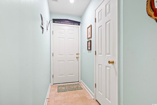 doorway featuring light tile patterned floors