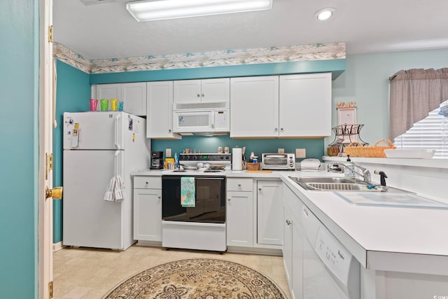 kitchen featuring light tile patterned flooring, sink, white appliances, and white cabinetry