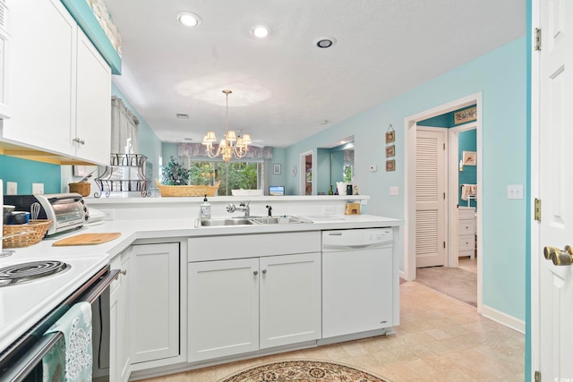 kitchen featuring hanging light fixtures, dishwasher, sink, kitchen peninsula, and an inviting chandelier