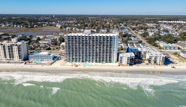 aerial view with a water view and a beach view