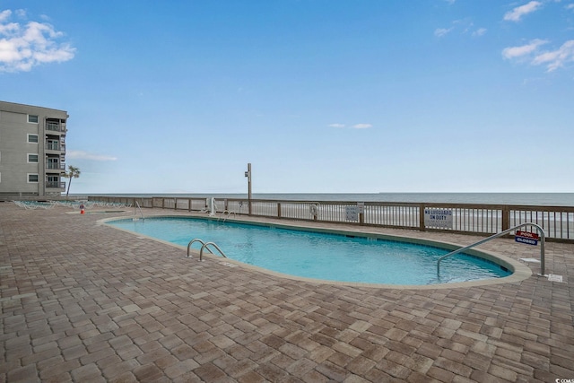 pool featuring a patio area