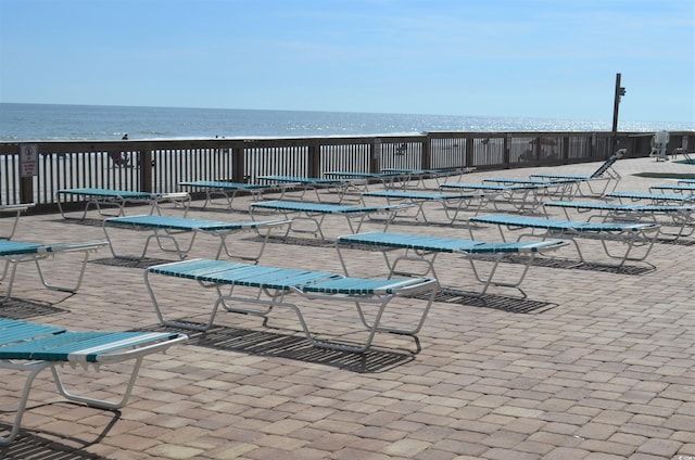 view of pool featuring a water view