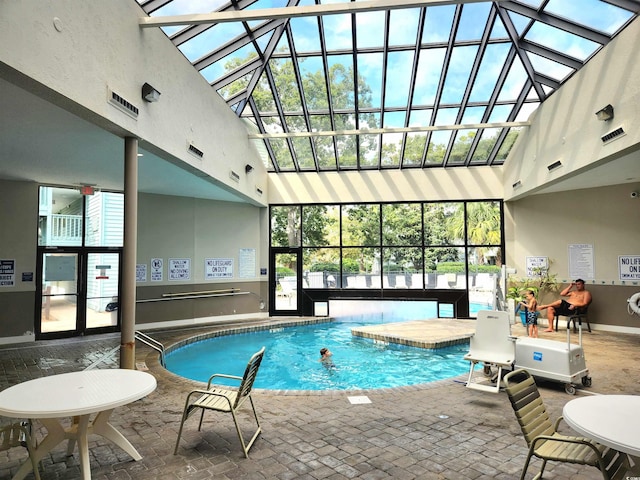 community pool featuring a skylight