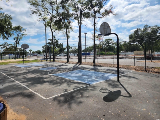 view of sport court featuring community basketball court and fence