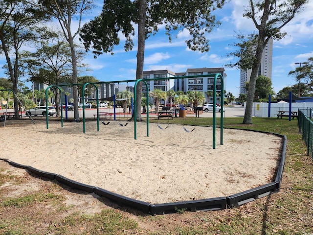 surrounding community with playground community and fence