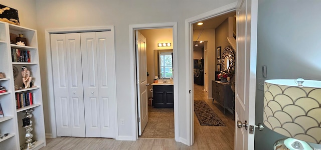 interior space featuring connected bathroom and a closet