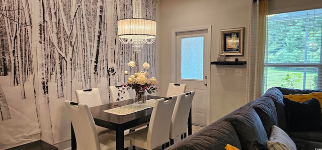 dining space featuring a notable chandelier