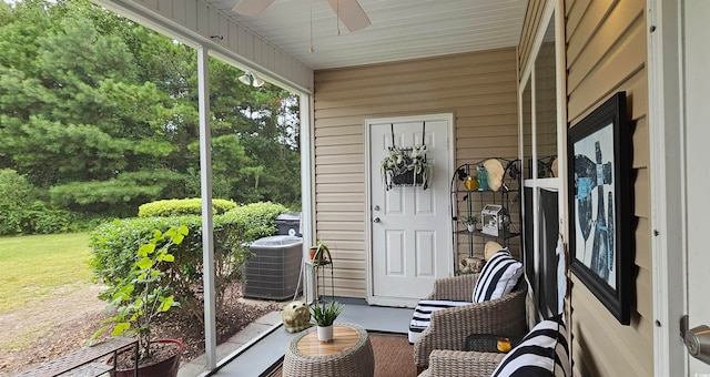 sunroom / solarium featuring ceiling fan