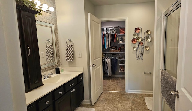 bathroom featuring tile patterned flooring and vanity