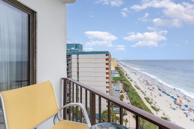 balcony with a beach view and a water view