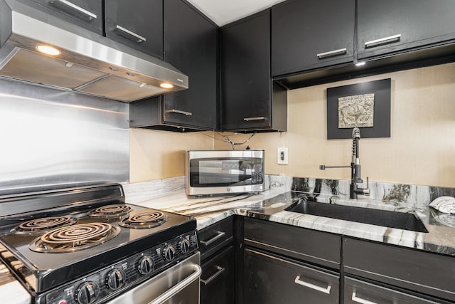 kitchen featuring wall chimney range hood, sink, and stove