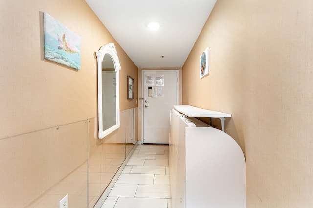 hallway with light tile patterned flooring