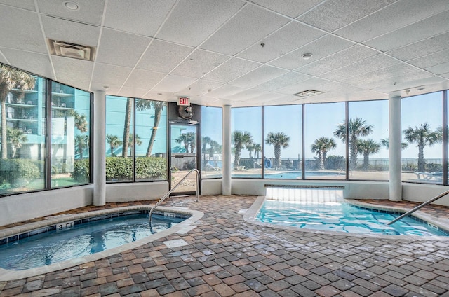 view of swimming pool with an indoor in ground hot tub