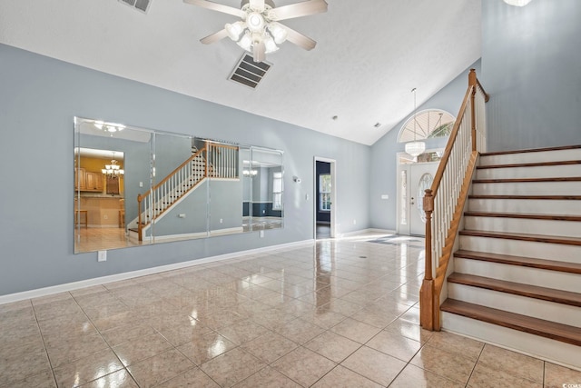 interior space featuring high vaulted ceiling, a textured ceiling, and ceiling fan with notable chandelier