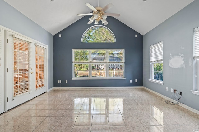 spare room with high vaulted ceiling and ceiling fan