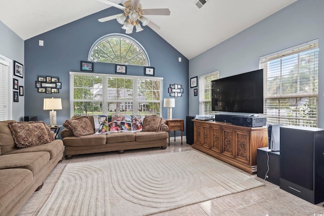 living room with ceiling fan, high vaulted ceiling, and light tile patterned floors