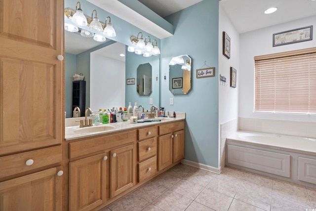 bathroom featuring vanity, tile patterned floors, and a bathing tub