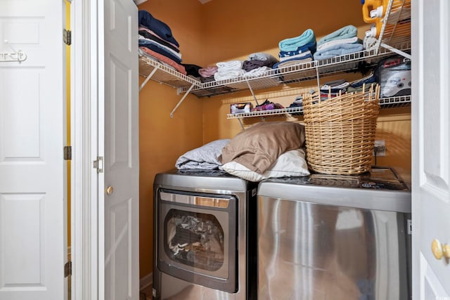 washroom with washer and dryer