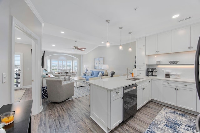 kitchen featuring sink, ceiling fan, hardwood / wood-style flooring, and backsplash