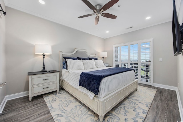 bedroom with hardwood / wood-style floors, ornamental molding, and ceiling fan