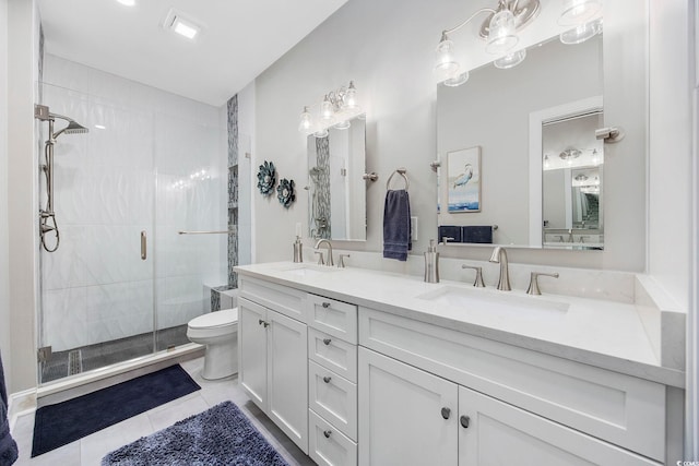 bathroom featuring a shower with shower door, toilet, tile patterned floors, and vanity