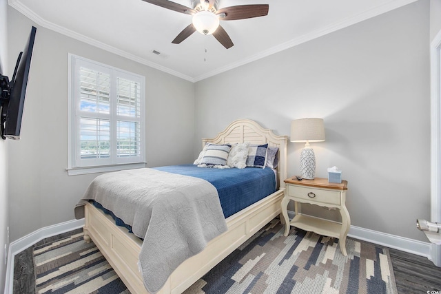 bedroom featuring ceiling fan, crown molding, and wood-type flooring