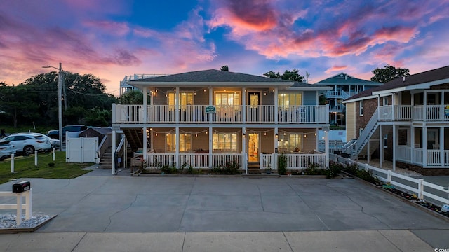 view of front of house featuring a balcony and a porch