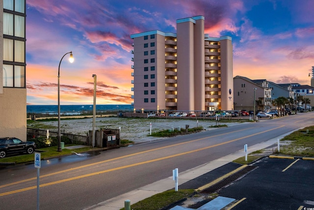 view of outdoor building at dusk